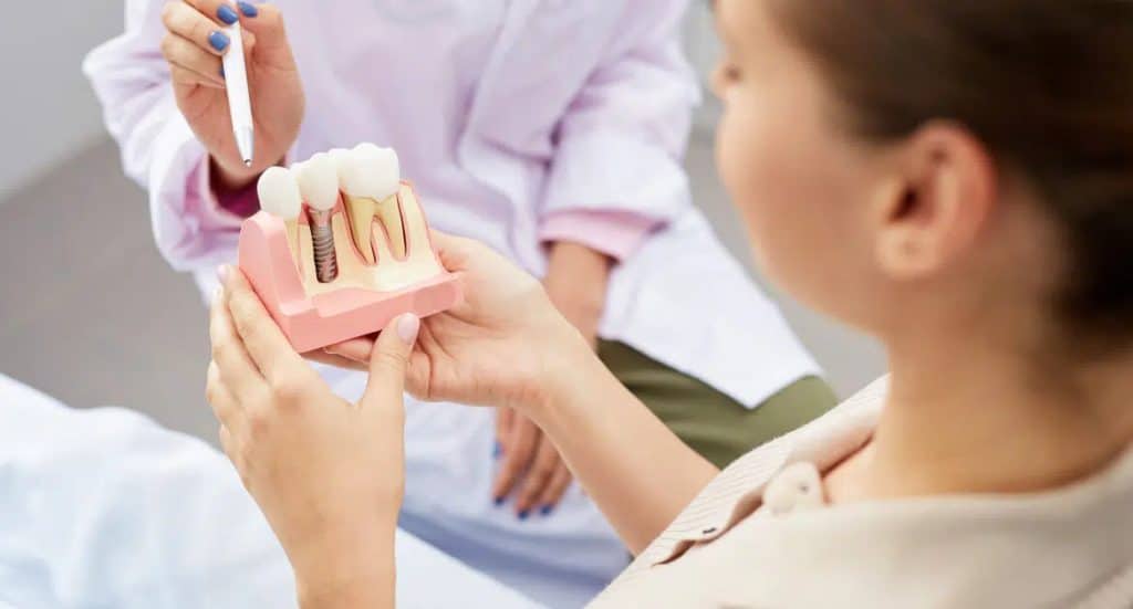 Dentist explaining implant treatment