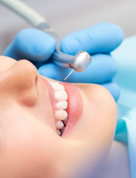 Dentist examining patient's teeth in clinic
